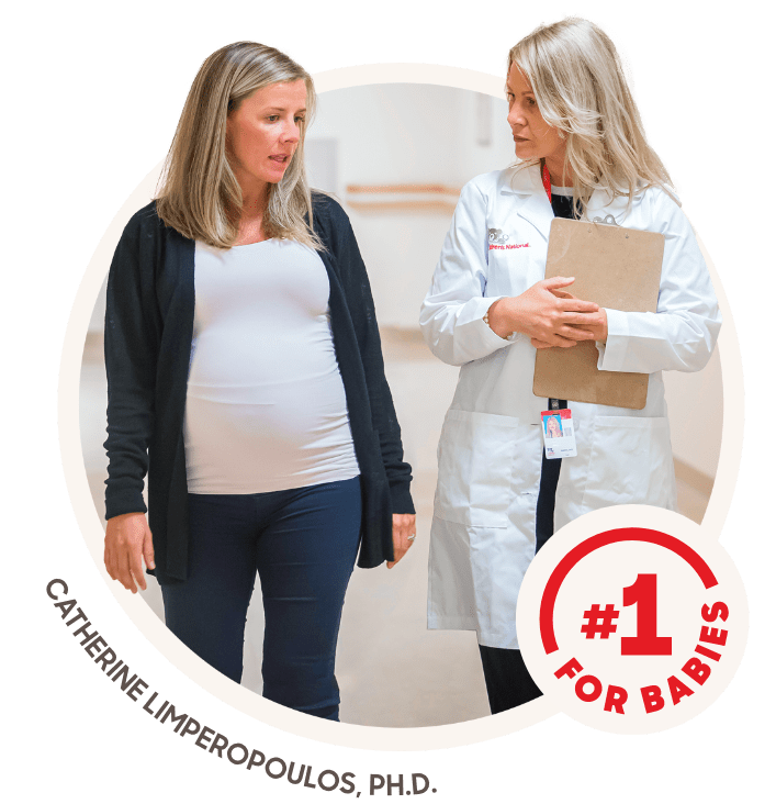 Pregnant mom and doctor walking
